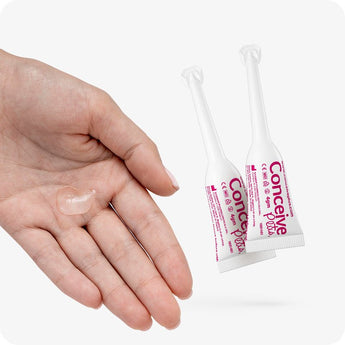 For Conceive Plus Max Combo - Fertility Lubricant Bundle, showing two 4g pre-filled fertility lubricant applicators positioned beside a hand displaying a small amount of lubricant gel, emphasizing ease of use, smooth texture, and targeted application for fertility support.