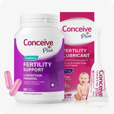 Conceive Plus Women's Fertility Support and Fertility Lubricant Bundle showing a white bottle of 60 vegan prenatal capsules labeled "Fertility Support" in purple tones, next to a boxed 3x4g pre-filled fertility lubricant applicators with a visible baby photo on packaging and one applicator placed upright in front.